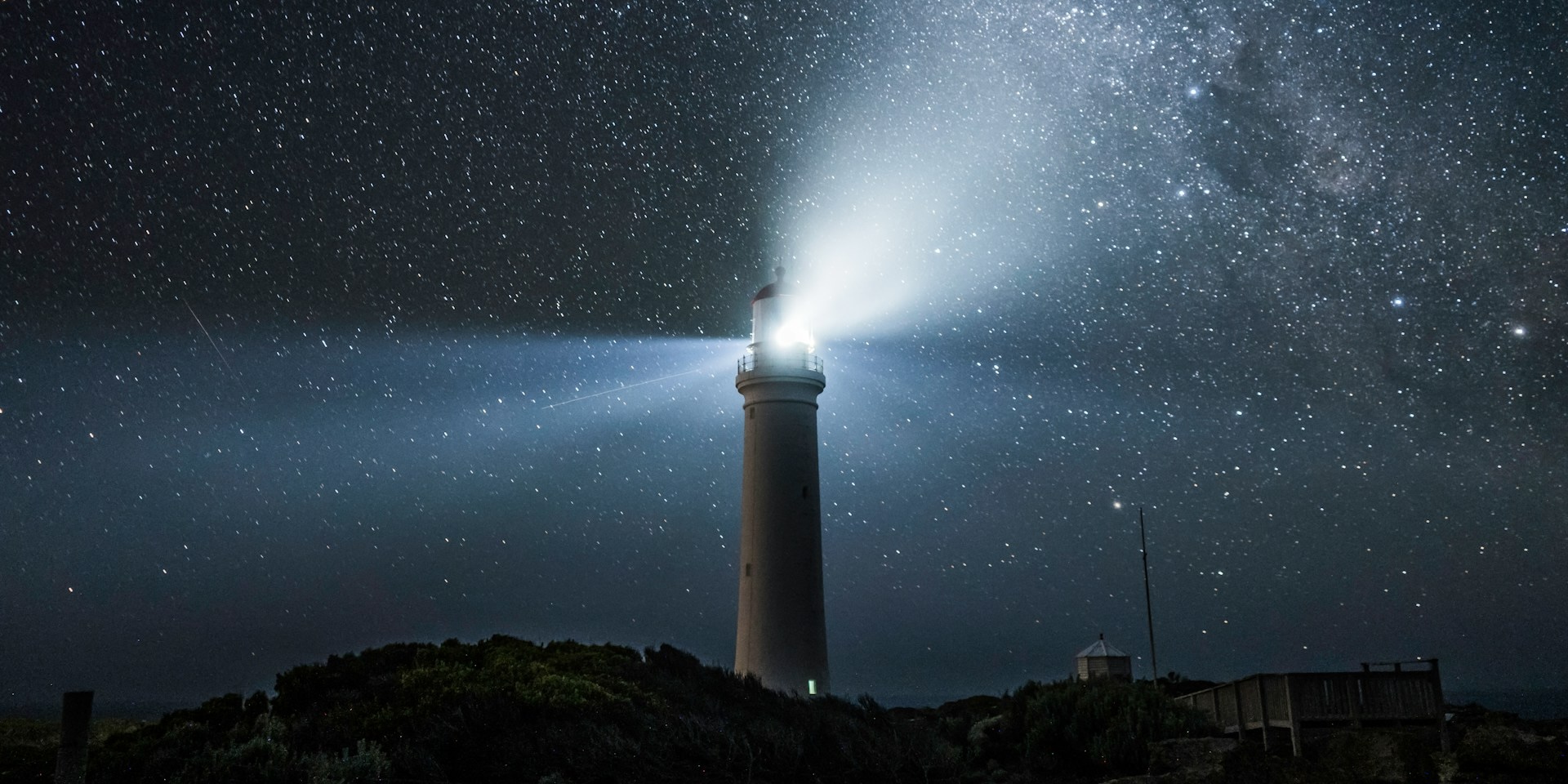 Spotlight from a Lighthouse. Photo by Nathan Jennings on Unsplash
